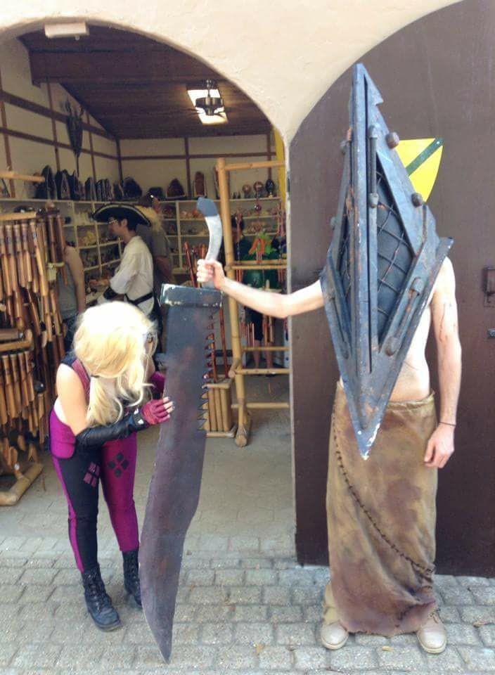 Harley Quinn admiring Pyramid Head's weapon